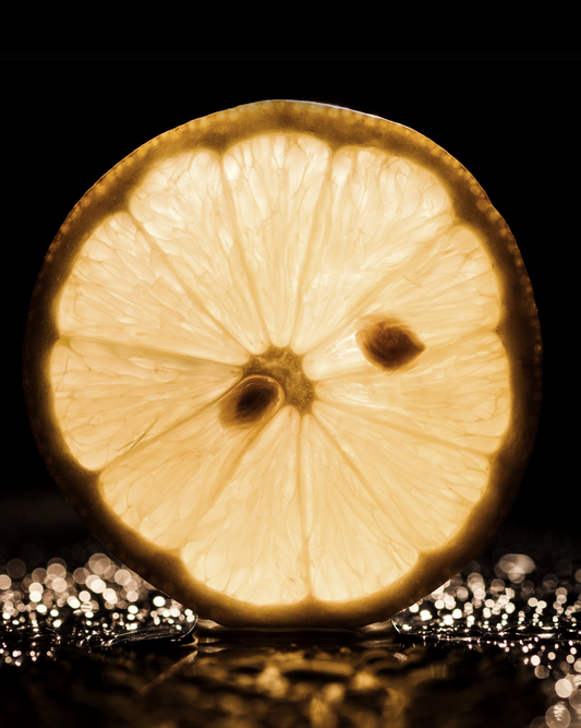 Lemon slice symbolizing the fresh citrus top note of Aqua Dusk Fragrance Oil
