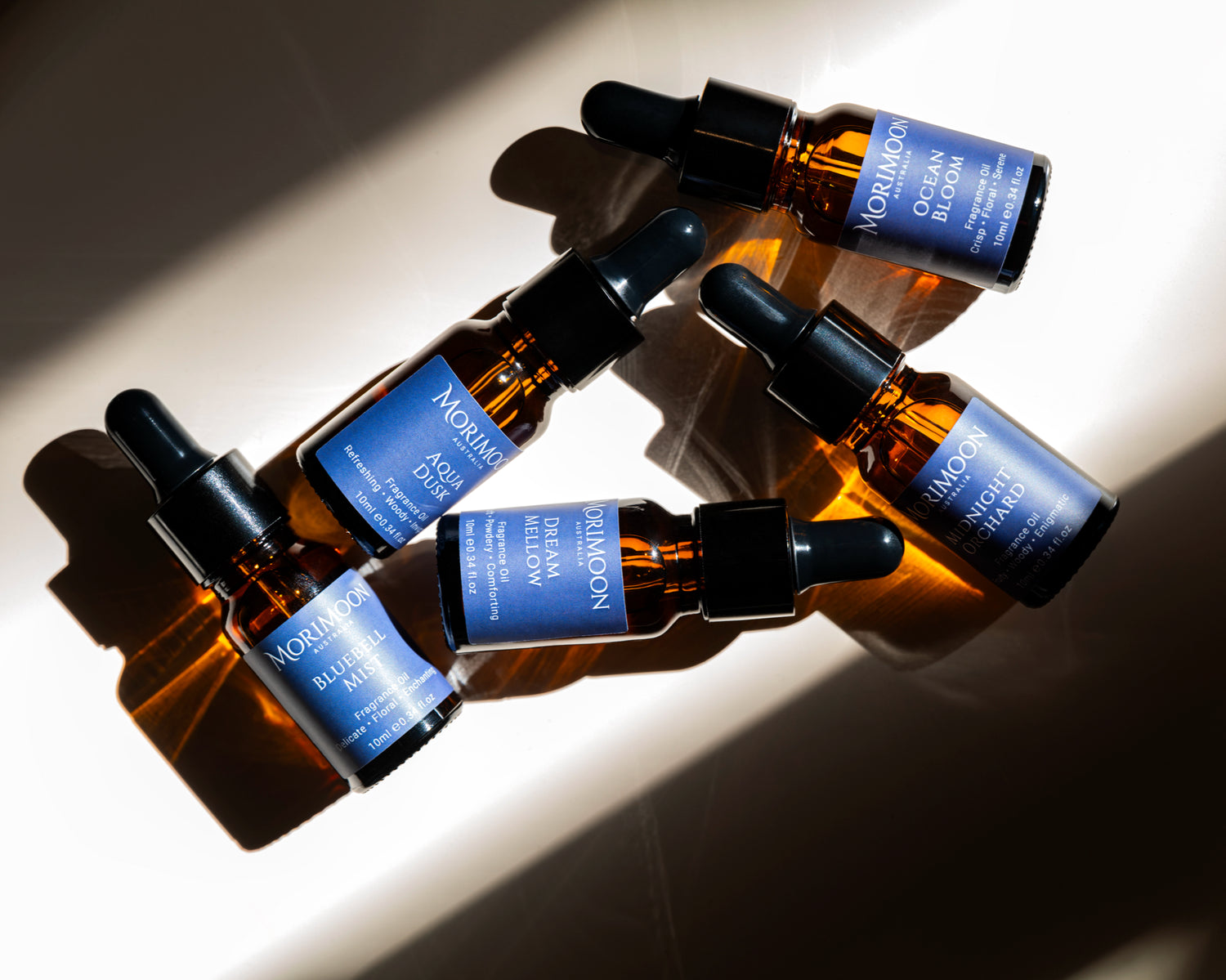 Morimoon fragrance oil collection flat lay with multiple bottles